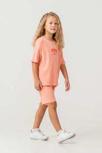 Set 2 Piese Fată - Tricou Și Pantaloni Scurți Oversize Orange Deschis Cu Logo USPA